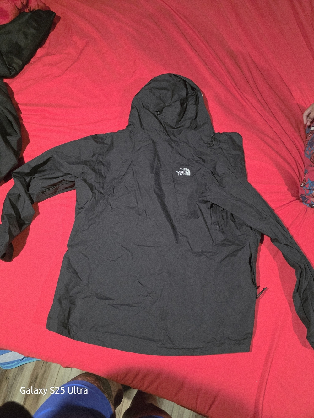 The North Face Woman’s Black Hooded Rain Jacket (Hood Is Peeling)